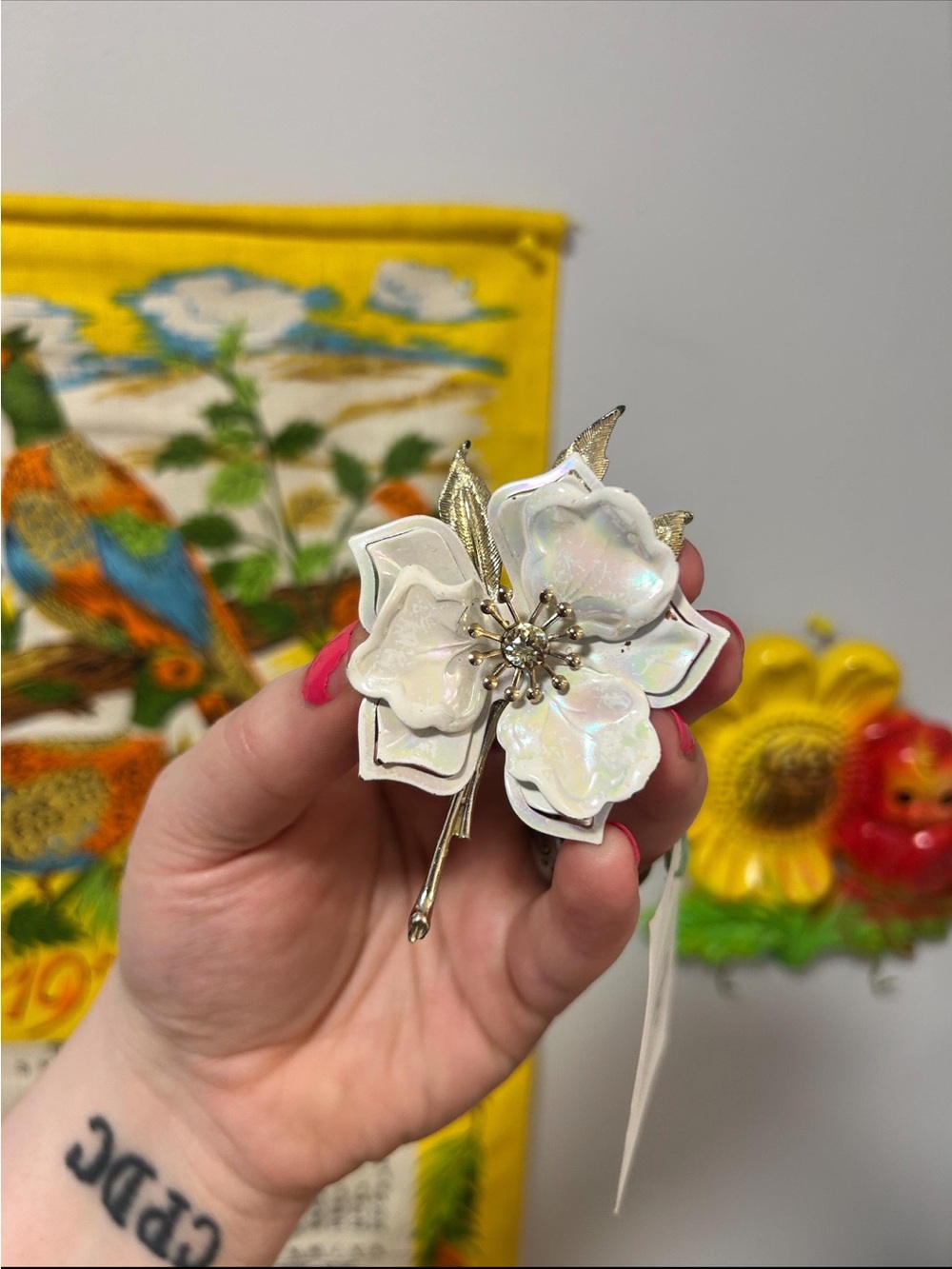 Vintage Elegant White Floral Brooch with Iridescent Petals